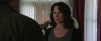 Movie still from “Insidious: Chapter 2” (2013), directed by James Wan – A person looking at a mirror; Close Up shot, Over the shoulder angle