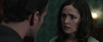 Movie still from “Insidious: Chapter 2” (2013), directed by James Wan – A man and a woman looking at one another in the mirror; Close Up shot, Over the shoulder angle