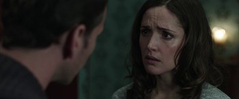 Movie still from “Insidious: Chapter 2” (2013), directed by James Wan – A man and a woman looking at one another in the mirror; Close Up shot, Over the shoulder angle