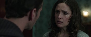 Movie still from “Insidious: Chapter 2” (2013), directed by James Wan – A man and a woman looking at one another in a dark room; Close Up shot, Over the shoulder angle