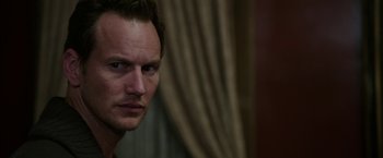 Movie still from “Insidious: Chapter 2” (2013), directed by James Wan – A person looking at the camera; Close Up shot, Over the shoulder angle