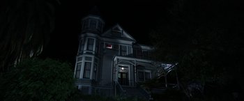 Movie still from “Insidious: Chapter 2” (2013), directed by James Wan – A large house in the dark at night time; Extreme Wide shot, Low angle
