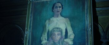 Movie still from “Insidious: Chapter 2” (2013), directed by James Wan – A painting of a woman and a boy in the rain; Close Up shot, Overhead angle