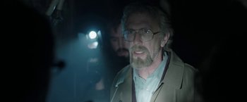 Movie still from “Insidious: Chapter 2” (2013), directed by James Wan – An older man wearing glasses and a jacket; Close Up shot, Over the shoulder angle