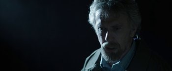 Movie still from “Insidious: Chapter 2” (2013), directed by James Wan – A person with a beard; Close Up shot, Over the shoulder angle