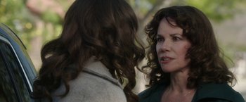 Movie still from “Insidious: Chapter 2” (2013), directed by James Wan – A woman is talking to another woman outside; Close Up shot, Over the shoulder angle