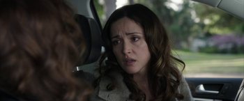 Movie still from “Insidious: Chapter 2” (2013), directed by James Wan – A woman is looking in the side mirror of a car; Close Up shot, Over the shoulder angle