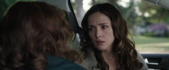 Movie still from “Insidious: Chapter 2” (2013), directed by James Wan – A woman looking at another woman in a car; Close Up shot, Over the shoulder angle