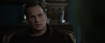 Movie still from “Insidious: Chapter 2” (2013), directed by James Wan – A person sitting in a chair; Close Up shot, Over the shoulder angle