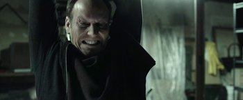 Movie still from “Insidious: Chapter 2” (2013), directed by James Wan – A person's face with a vampire mask; Close Up shot, Low angle