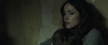 Movie still from “Insidious: Chapter 2” (2013), directed by James Wan – A person wearing a fur coat; Close Up shot, Over the shoulder angle