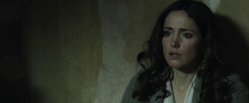 Movie still from “Insidious: Chapter 2” (2013), directed by James Wan – A woman with long brown curly hair is crying; Close Up shot, Over the shoulder angle