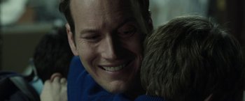 Movie still from “Insidious: Chapter 2” (2013), directed by James Wan – A person holding a child; Close Up shot, Over the shoulder angle