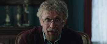 Movie still from “Insidious: Chapter 2” (2013), directed by James Wan – An older man with a beard and glasses; Close Up shot, Low angle