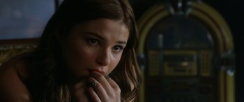 Movie still from “Insidious: Chapter 3” (2015), directed by Leigh Whannell – A beautiful young lady holding her hand to her face; Close Up shot, Over the shoulder angle