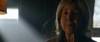 Movie still from “Insidious: Chapter 3” (2015), directed by Leigh Whannell – A woman's face in the dark; Close Up shot, Over the shoulder angle