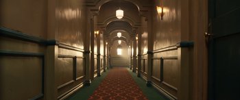 Movie still from “Insidious: Chapter 3” (2015), directed by Leigh Whannell – A long hallway with a red carpet and green carpet; Extreme Wide shot, High angle