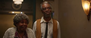 Movie still from “Insidious: Chapter 3” (2015), directed by Leigh Whannell – An older man wearing a vest and a tie; Medium shot, Low angle