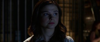 Movie still from “Insidious: Chapter 3” (2015), directed by Leigh Whannell – A woman with blue eyes stares into the distance; Close Up shot, Over the shoulder angle