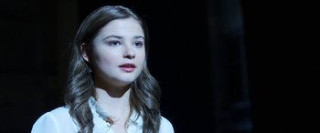 Movie still from “Insidious: Chapter 3” (2015), directed by Leigh Whannell – A young woman with long brown hair looking up at the sky; Close Up shot, Over the shoulder angle