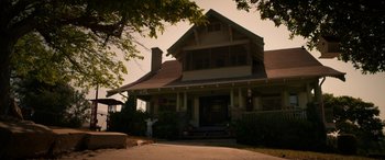 Movie still from “Insidious: Chapter 3” (2015), directed by Leigh Whannell – An old style house with a large porch and a large tree; Extreme Wide shot, Low angle