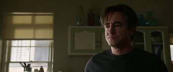 Movie still from “Insidious: Chapter 3” (2015), directed by Leigh Whannell – A person in a living room; Close Up shot, Over the shoulder angle