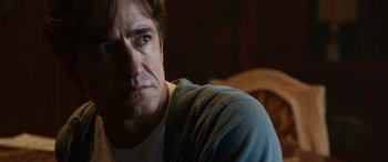 Movie still from “Insidious: Chapter 3” (2015), directed by Leigh Whannell – A person wearing a shirt; Close Up shot, Over the shoulder angle