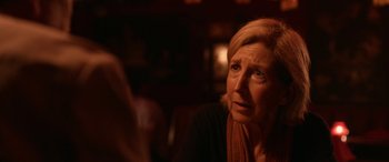 Movie still from “Insidious: Chapter 3” (2015), directed by Leigh Whannell – An older woman sitting at a table in front of a mirror; Close Up shot, Over the shoulder angle