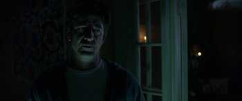 Movie still from “Insidious: Chapter 3” (2015), directed by Leigh Whannell – A man standing in front of a window at night; Close Up shot, Low angle