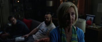 Movie still from “Insidious: Chapter 3” (2015), directed by Leigh Whannell – An older woman sitting next to a bearded man; Close Up shot, Over the shoulder angle