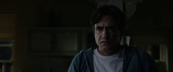 Movie still from “Insidious: Chapter 3” (2015), directed by Leigh Whannell – A person wearing a white t shirt; Close Up shot, Over the shoulder angle