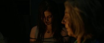 Movie still from “Insidious: Chapter 3” (2015), directed by Leigh Whannell – A woman with long hair is looking at another woman with long hair; Close Up shot, Over the shoulder angle