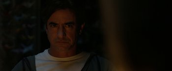 Movie still from “Insidious: Chapter 3” (2015), directed by Leigh Whannell – A person in a dark room; Close Up shot, Over the shoulder angle