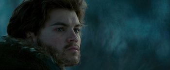 Movie still from “Into the Wild” (2007), directed by Sean Penn – A person with a beard looking at the camera; Close Up shot, Low angle