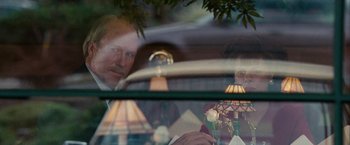 Movie still from “Into the Wild” (2007), directed by Sean Penn – A man and a woman sitting at a table in front of a window; Close Up shot, Over the shoulder angle