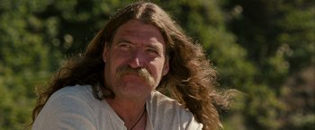 Movie still from “Into the Wild” (2007), directed by Sean Penn – A person with long hair; Close Up shot, Low angle