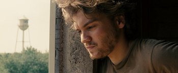 Movie still from “Into the Wild” (2007), directed by Sean Penn – A person wearing a brown shirt; Close Up shot, Low angle