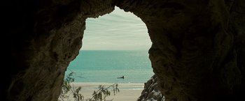 Movie still from “Into the Wild” (2007), directed by Sean Penn – A person in a canoe on the ocean; Extreme Wide shot, High angle