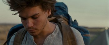 Movie still from “Into the Wild” (2007), directed by Sean Penn – A person with a backpack; Close Up shot, Over the shoulder angle
