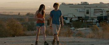 Movie still from “Into the Wild” (2007), directed by Sean Penn – A man and a woman are walking in the desert; Wide shot, Over the shoulder angle