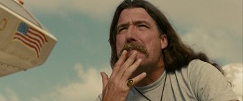 Movie still from “Into the Wild” (2007), directed by Sean Penn – A person with a beard and a mustache; Close Up shot, Low angle