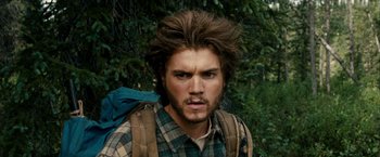 Movie still from “Into the Wild” (2007), directed by Sean Penn – A person with a backpack; Close Up shot, Over the shoulder angle