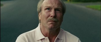 Movie still from “Into the Wild” (2007), directed by Sean Penn – An older man with a mustache and a beard looking at the camera; Close Up shot, Low angle