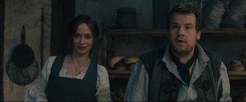 Movie still from “Into the Woods” (2014), directed by Rob Marshall – A man and a woman standing next to each other; Medium shot, Over the shoulder angle