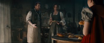 Movie still from “Into the Woods” (2014), directed by Rob Marshall – A man and a woman standing next to each other in a kitchen; Medium shot, High angle