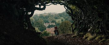 Movie still from “Into the Woods” (2014), directed by Rob Marshall – A person riding a horse through a forest; Extreme Wide shot, Low angle