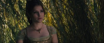 Movie still from “Into the Woods” (2014), directed by Rob Marshall – A beautiful young lady wearing a gold dress; Close Up shot, Over the shoulder angle