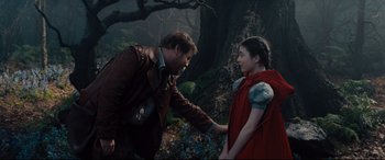 Movie still from “Into the Woods” (2014), directed by Rob Marshall – A man and a woman holding hands in the woods; Medium shot, Over the shoulder angle