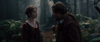 Movie still from “Into the Woods” (2014), directed by Rob Marshall – A man and a woman standing next to each other in the woods; Medium shot, Over the shoulder angle