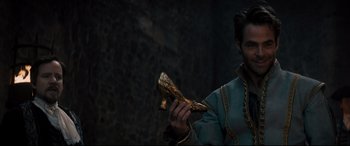 Movie still from “Into the Woods” (2014), directed by Rob Marshall – A man holding a wooden object in his hands; Close Up shot, Low angle